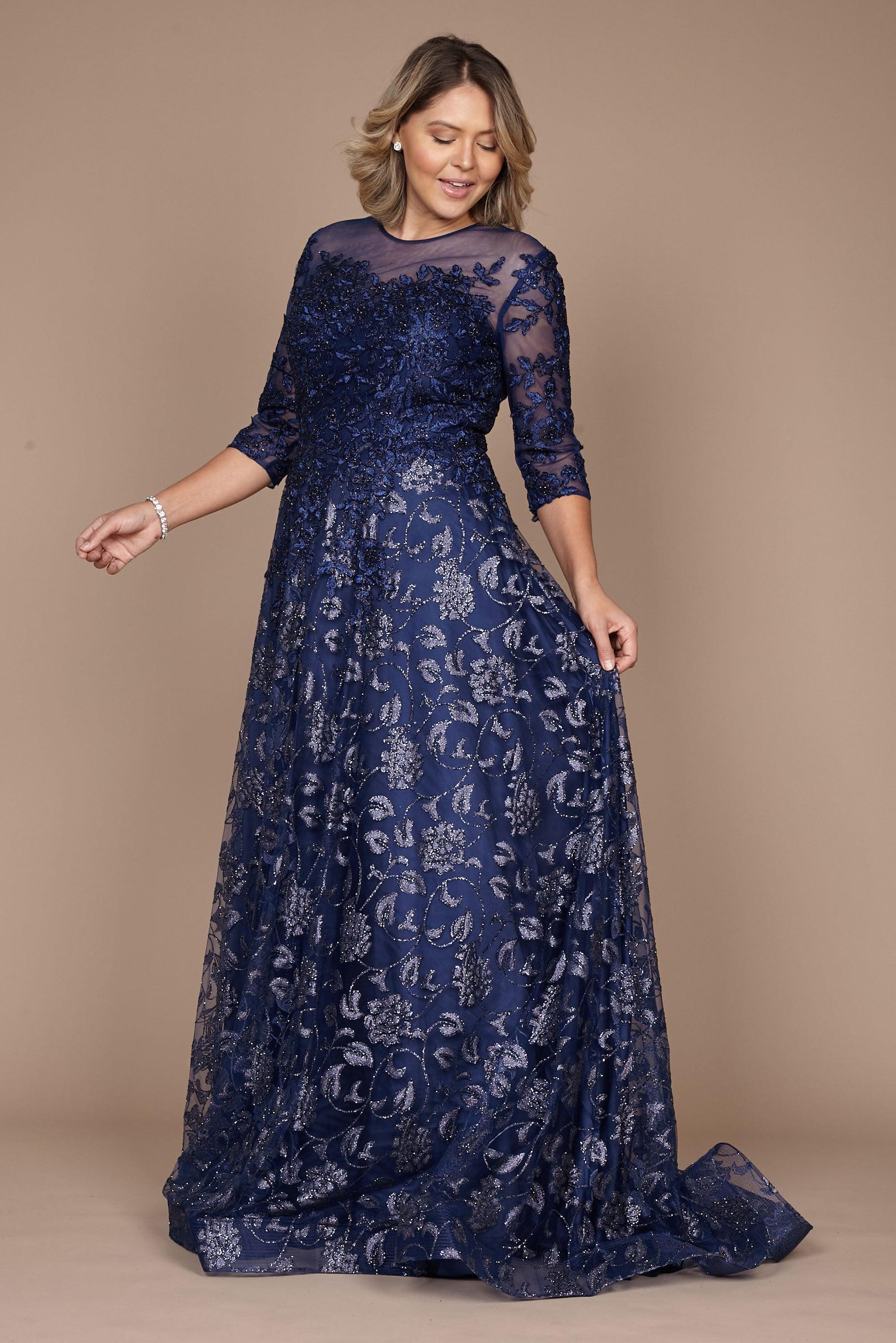 A stunning long formal lace evening dress in navy, featuring intricate lace detailing and a flowing silhouette, perfect for elegant occasions.