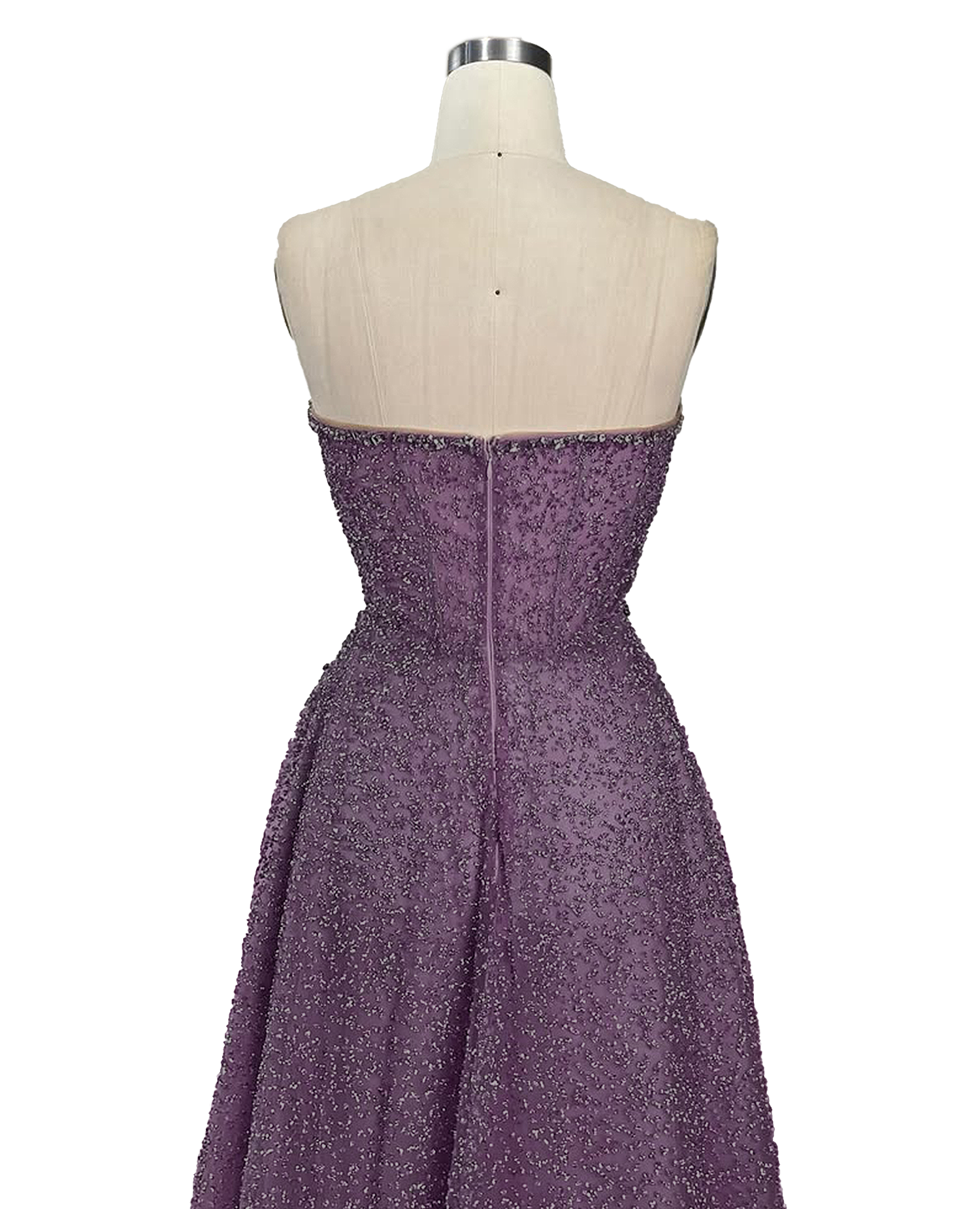 A stunning long strapless formal couture dress adorned with intricate hand-beaded details, showcasing elegance and sophistication.